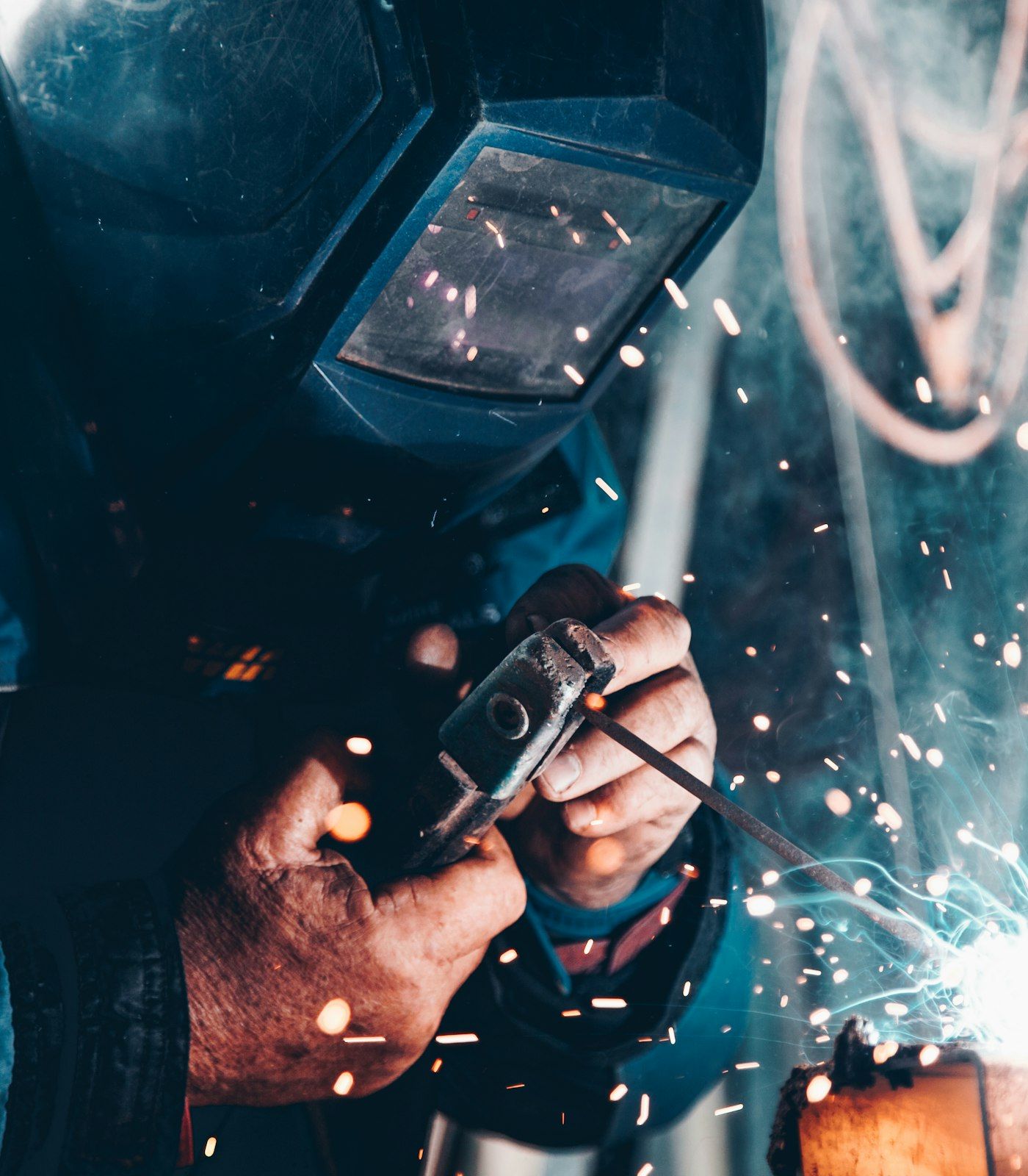 Welder at work in a metal workshop